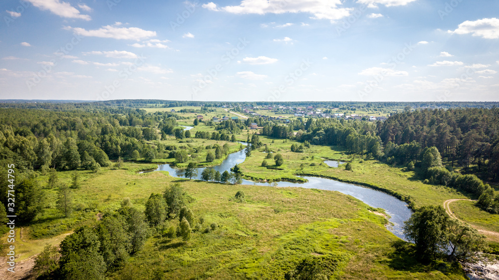 Field and river Usherka near Sudogda in summer, shooting from a quadcopter. Russia, Vladimir region