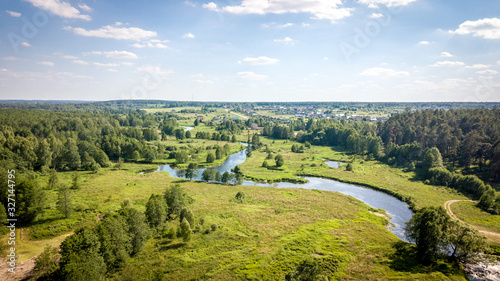 Field and river Usherka near Sudogda in summer, shooting from a quadcopter. Russia, Vladimir region