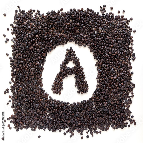 Letter A made out of aromatic coffee beans, top view, isolated on white background. Letter from word Aroma.