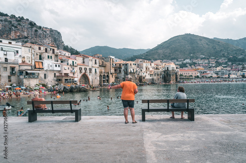 Cefalù, Sicily, Italy - August 22, 2019. The old buildings on the sea of Cefalù, an old fishing Sicilian village