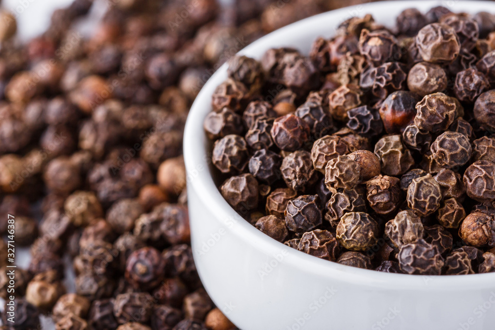 fragrant black pepper on white acrylic background fragrant black pepper on white acrylic background