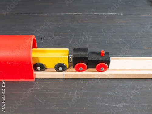 Wooden toy train with dark background