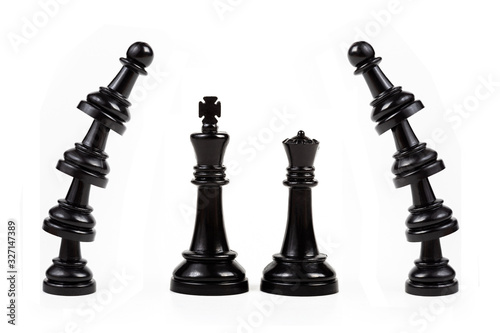 King and queen wedding black chess pieces scene concept. Royal couple, gate, border, frame made of stacked pawn game pieces. Man and women, majestic leaders, marriage simple abstract concept, nobody