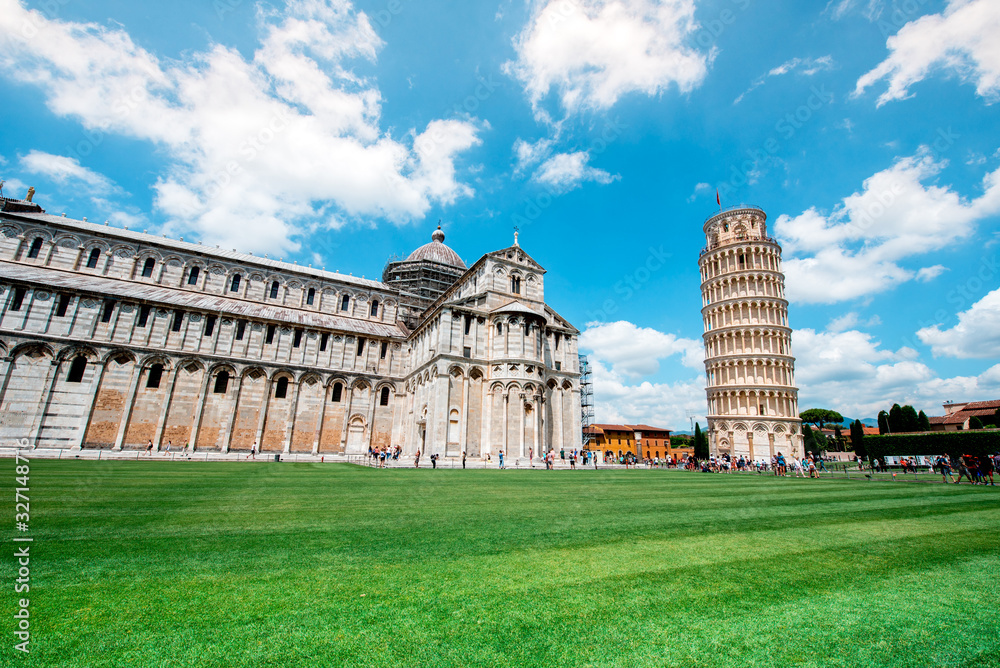 Picturesque landscape with cathedral or Duomo di Santa Maria Assunta near famous Leaning Tower in Pisa, Italy. fascinating exotic amazing places. Piazza dei Miracoli.