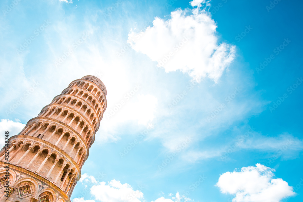Picturesque landscape with famous sloping tower in Pisa, Italy against sky backgrounds with clouds. fascinating exotic amazing places.