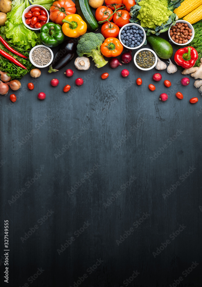 Dieting and healthy eating concept: fruits, vegetables, vegan food ingredients over natural background.