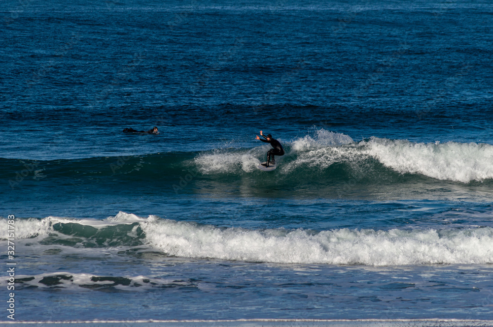 Sport surfing on the beach of zurriola located in san sebastian spain Sport surfing on the beach of zurriola located in san sebastian spain