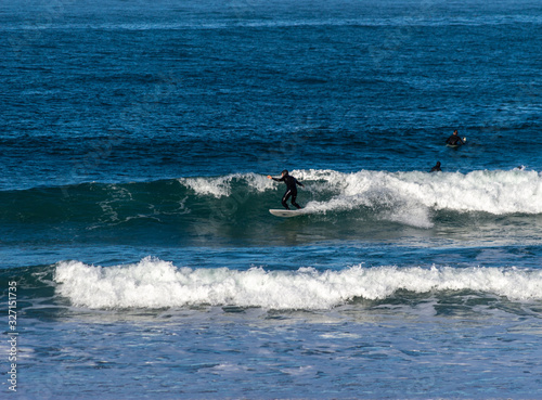 Canvas Print Sport surfing on the beach of zurriola located in san sebastian spain