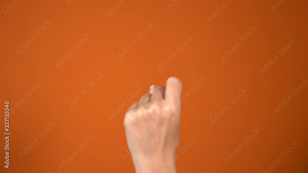 Closeup 4k video of isolated female hand counting from 0 to 5 and backwards from five to zero. Woman shows fist first, then one, two, three, four, five fingers. Manicured nails. Math concept.
