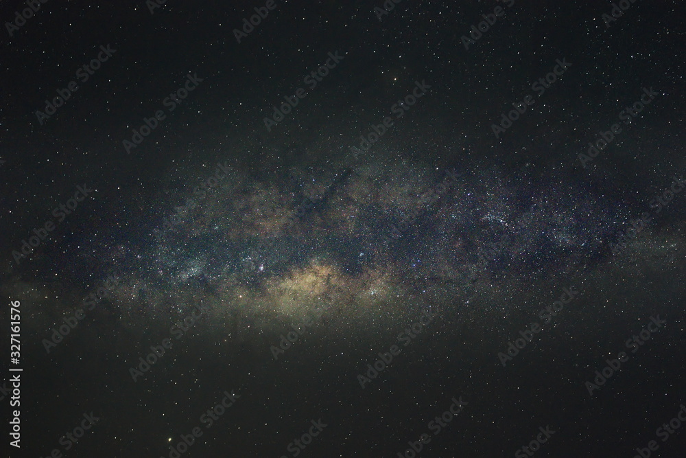 Clearly milky way galaxy in the night sky. Image contains noise and grain due to high ISO. Image also contains soft focus and blur due to long exposure and wide aperture