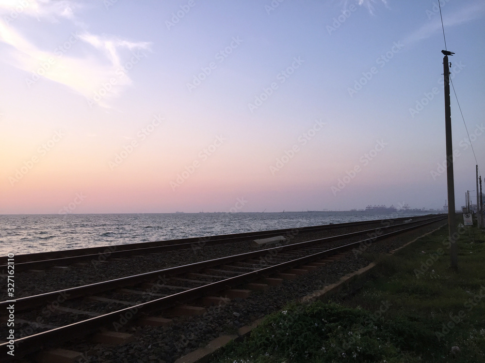 Colombo, Sri Lanka - 20th March 2018 : Oceanview along with the railroad at sunset