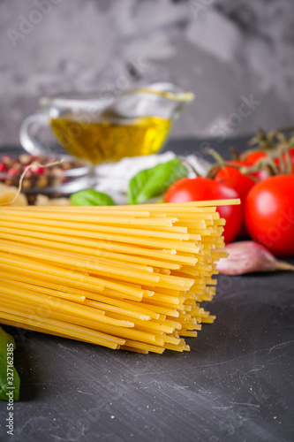 concept of traditional italian pasta with tomatoes and basil