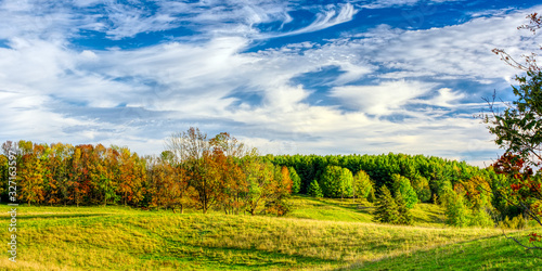 Panoramic high dynamic range image of autumn pasture and forested hills under a blue sky, Wingham, Huron County, southwestern Ontario, Canada photo