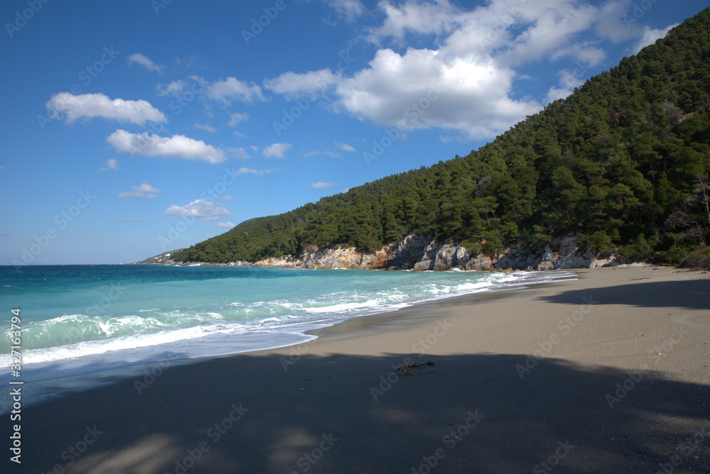 A beautiful beach on the island of Skopelos, Greece . her name is Kastani beach A beautiful beach on the island of Skopelos, Greece . her name is Kastani beach