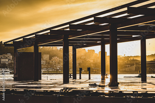 sunset on abandoned scaffolding on estuary in istanbul © JosephSpoon