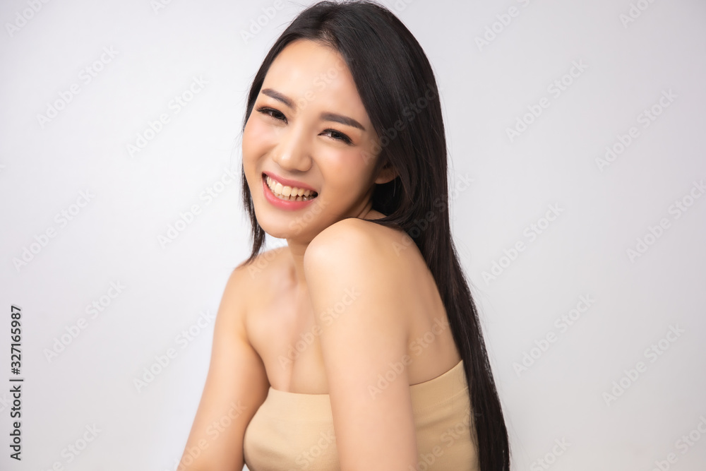 Beautiful Young Asian Woman short hair with Clean Fresh Skin. Face care, Facial treatment, Cosmetology, beauty and healthy skin and cosmetic ideas concept.pretty woman .beauty skin isolated on Beautiful Young Asian Woman short hair with Clean Fresh Skin. Face care, Facial treatment, Cosmetology, beauty and healthy skin and cosmetic ideas concept.pretty woman .beauty skin isolated on