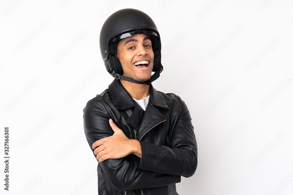 Young handsome man with a motorcycle helmet over isolated white background Young handsome man with a motorcycle helmet over isolated white background