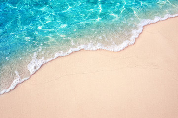 Beautiful Soft blue ocean wave on fine sandy beach