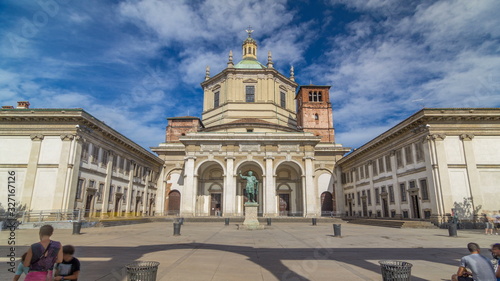 Facade of San Lorenzo Maggiore Basilica timelapse and statue of Constantine emperror in front.