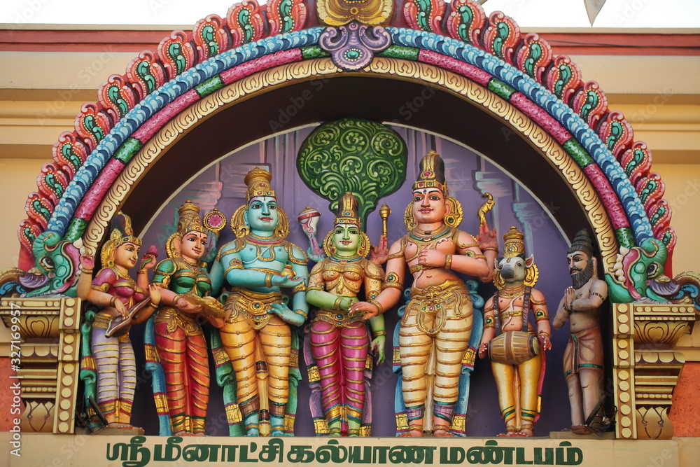 Fototapeta premium bright figures of the gods on the gopurama of a hindu temple in sri lanka