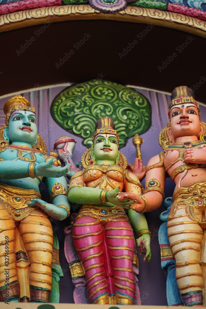 Fototapeta premium bright figures of the gods on the gopurama of a hindu temple in sri lanka