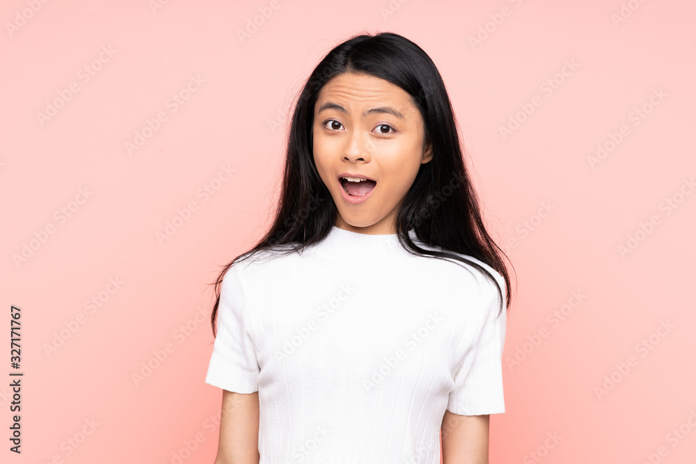Teenager Chinese woman isolated on pink background with surprise facial expression Teenager Chinese woman isolated on pink background with surprise facial expression