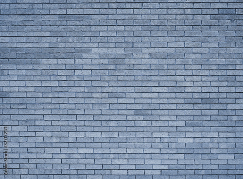 a full frame blue toned textured brick wall background