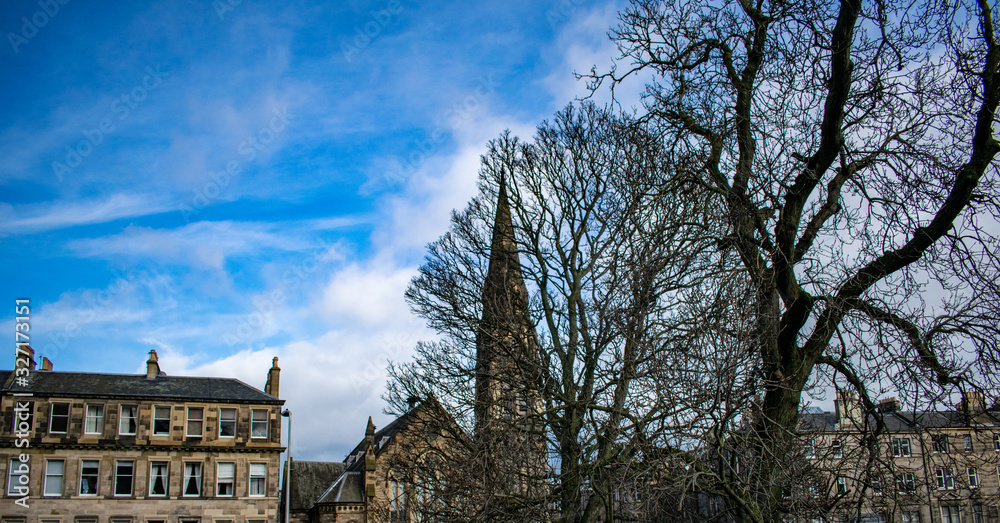 old house in the Edimburgh with blue sky with trees