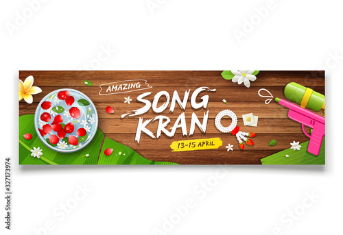 Songkran festival thailand bowl and gun water, flower on wood background banner design, vector illustration