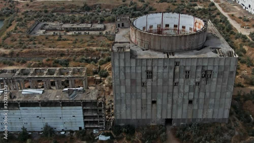 The concept of regeneration of nature. View of an abandoned industrial technical structure that is slowly absorbed by nature. The concept of regeneration of nature. View of an abandoned industrial technical structure that is slowly absorbed by nature.