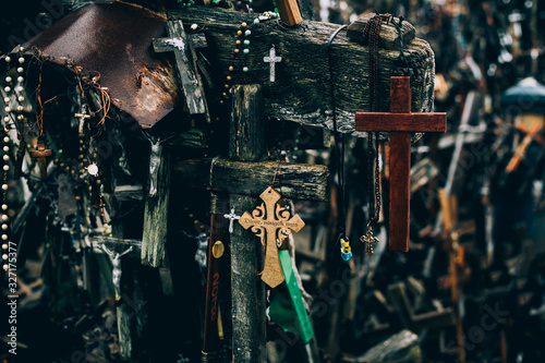 Closeup of mutliple ancient wooden crucifixes photo