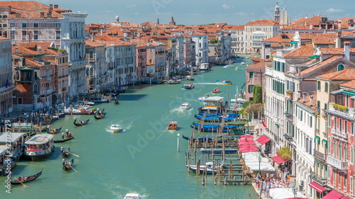 Top view on central busy canal in Venice timelapse, on both sides masterpieces of Venetian architecture