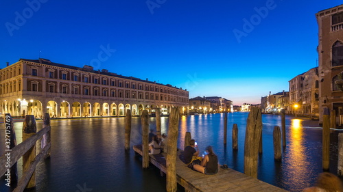 View of the deserted Rialto Market day to night timelapse after sunset, Venice, Italy viewed from pier across the Grand Canal