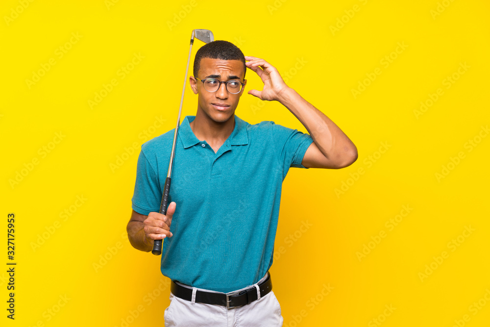 Naklejka premium African American golfer player man having doubts and with confuse face expression