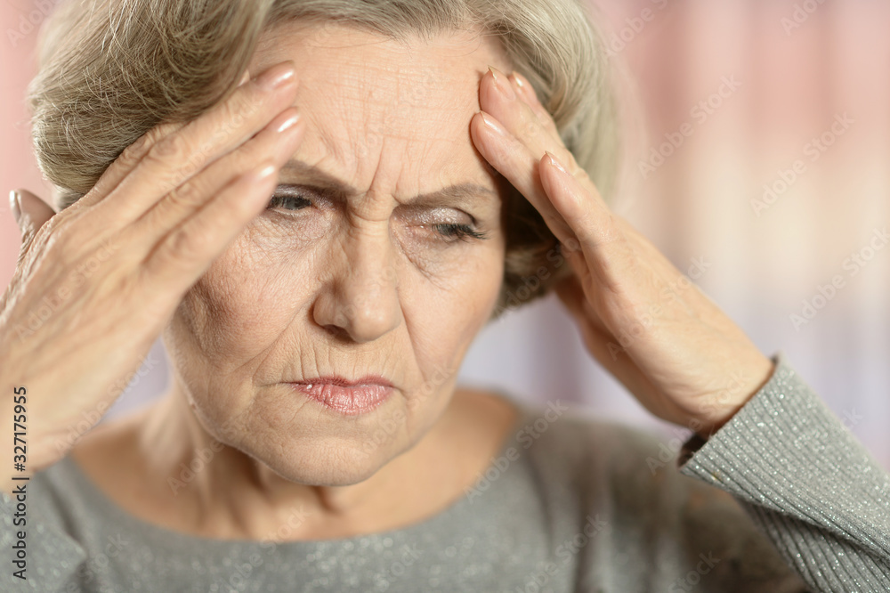 Portrait of beautiful senior woman with headache Portrait of beautiful senior woman with headache