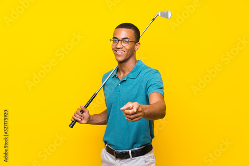 African American golfer player man points finger at you with a confident expression