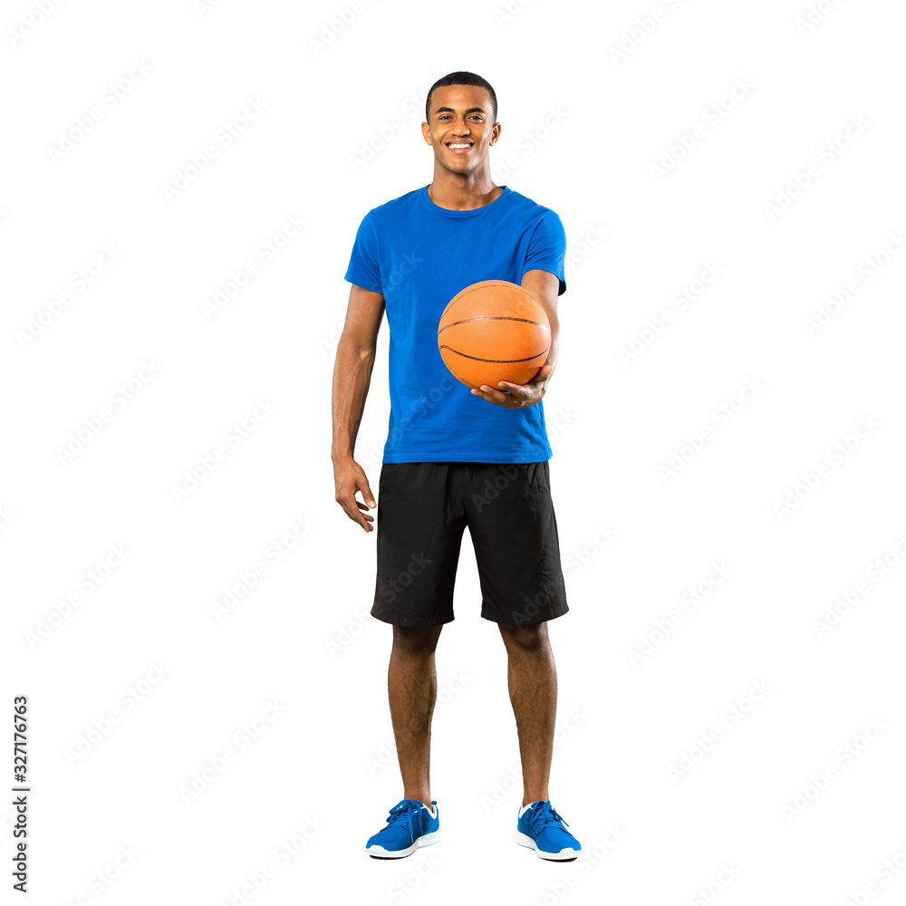 Full-length shot of Afro American basketball player man over isolated white background Full-length shot of Afro American basketball player man over isolated white background