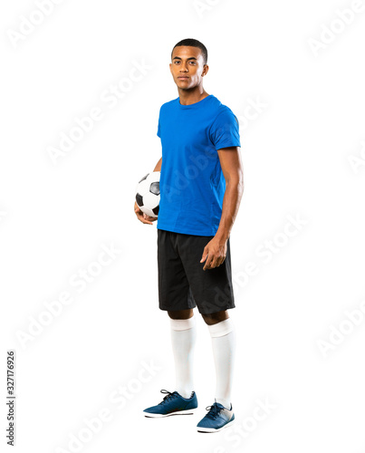Full-length shot of African American football player man over isolated white background