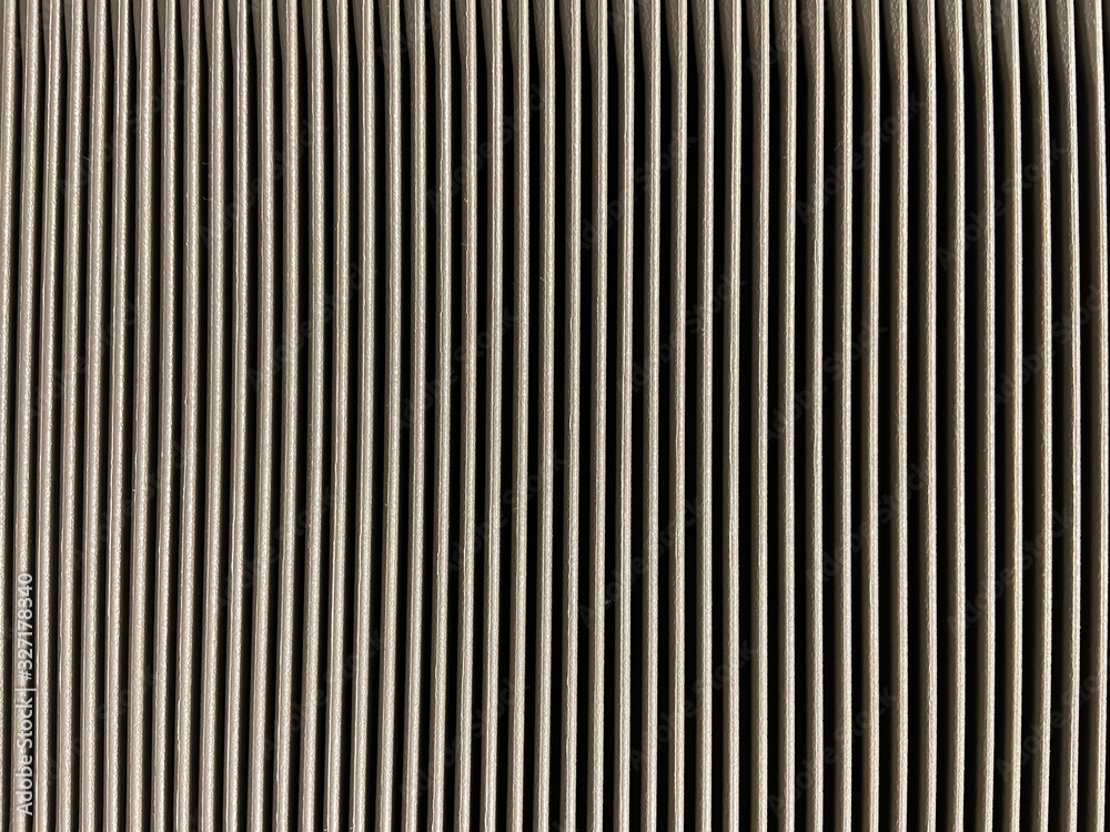 Repetition of small lines pattern in light brown and black lay vertically for background and texture Repetition of small lines pattern in light brown and black lay vertically for background and texture