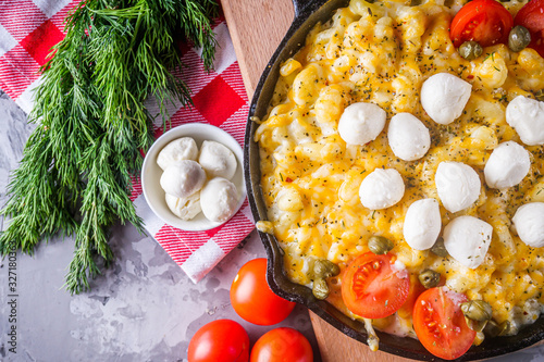 delicious pasta and cheese casserole in a cast iron skillet photo