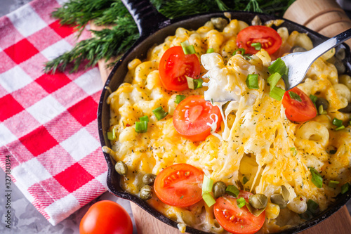 delicious pasta and cheese casserole in a cast iron skillet