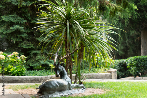 Obraz na płótnie Alushta, Crimea - August 4, 2016: Statue of a Deer in Aivazovsky park, Partenit village. w salonie