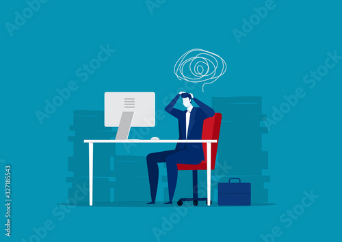 Stressed businessman working hard with a lot of papers background
