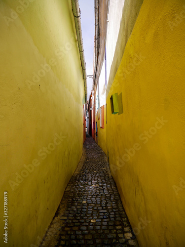 The colorful  Rope Street  ( in Romanian Strada Sforii) on medieval streets in Transylvania, Brasov city, one of the narrowest streets in Europe. photo