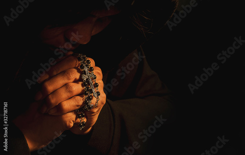 Christian women pray for blessings with faith on a black background.