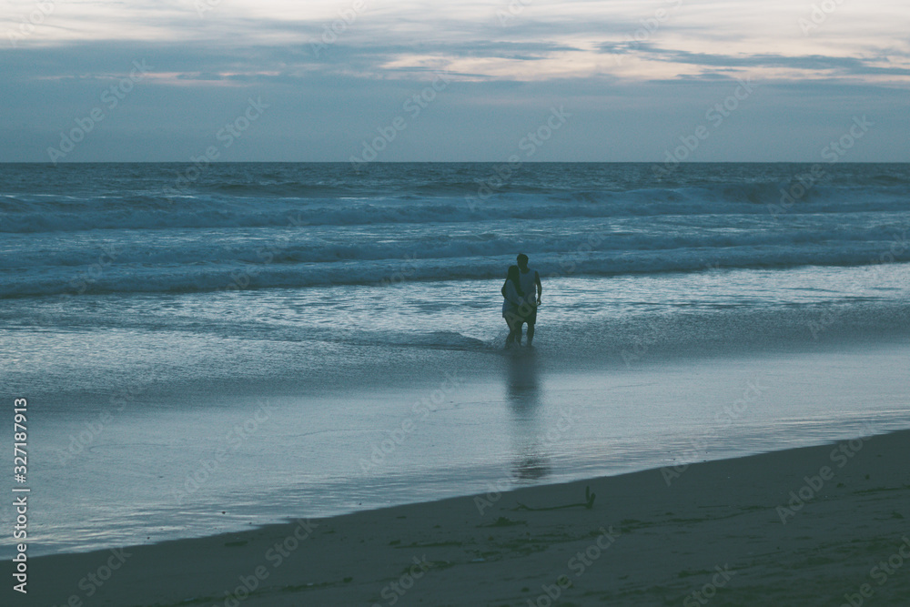people walking along the beach at sunset by the sea, beautiful evening landscape people walking along the beach at sunset by the sea, beautiful evening landscape