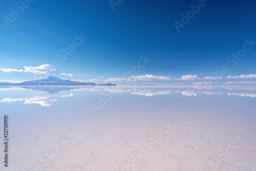 Miror effect and reflection of mountain in Salar de Uyuni (Uyuni salt flats), Potosi, Bolivia, South America