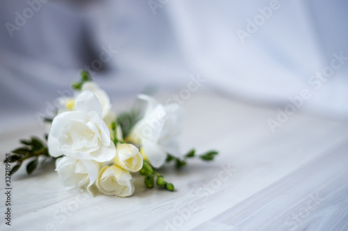 freesia flowers on a wooden table