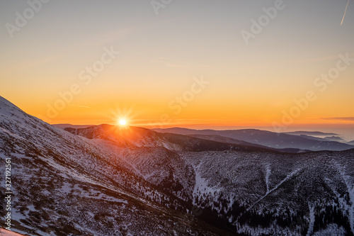 Sunrise on ridge in snowy mountains, Slovakia Low Tatras, dumbier