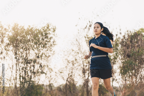 Asian woman running in the park ,Exercise concept, Lifestyle fitness and active women exercise in urban city concept.